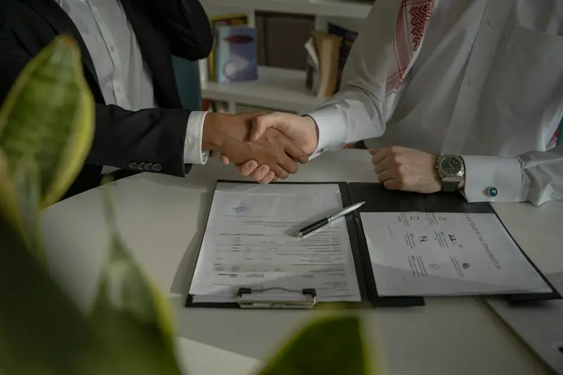Handshake over signed loan documents